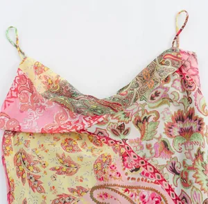 Detail of the colorful paisley patchwork print on a V-neck camisole summer dress