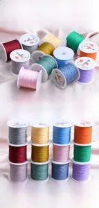 Macro detail of colorful 0.6mm jewelry weaving threads for DIY bracelet making.