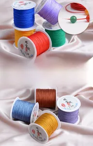Detailed view of 0.6mm non-elastic DIY jewelry braided thread in various colors