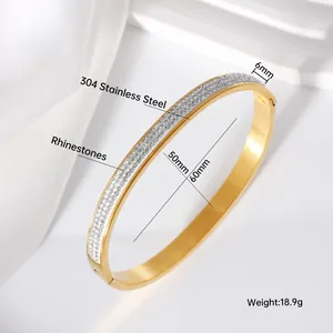 Detailed view of gold stainless steel bangle featuring rhinestones and exact dimensions