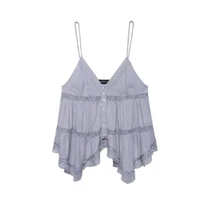 Detail view of elegant lavender V-neck camisole with lace trim and tiered ruffled hem