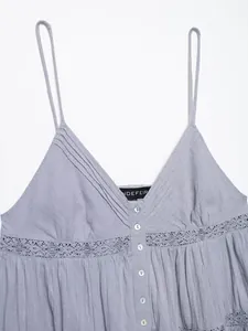 Detail showing elegant V-neck and lace crochet embroidery on camisole top