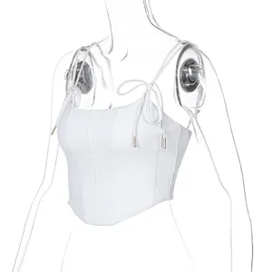 Detailed view of a white tie-up camisole top featuring corset-style stitching details.