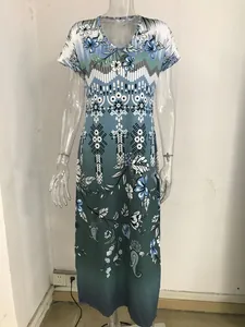 Detail view of women's floral print V-neck short sleeve maxi dress in gradient green.