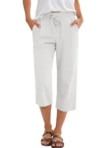 Detail view of women's white linen wide-leg pants with comfortable drawstring waist