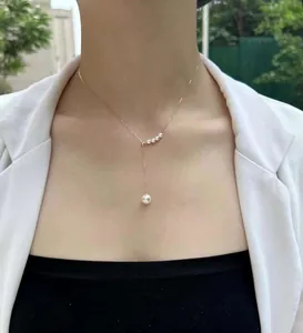 Detail view of elegant Y-shaped pearl necklace featuring high-quality round drop pearl.
