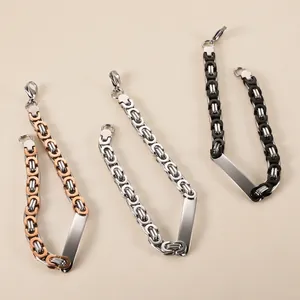 Detailed view of three stainless steel Byzantine link bracelets for men in mixed tones.