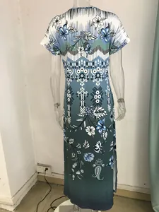 Detailed back view of a summer floral print maxi dress featuring a stylish side slit design