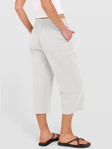 Back view of women's loose cotton linen wide-leg cropped trousers in light gray