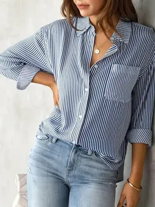 Detailed view of women's blue and white vertical striped loose casual button-down shirt