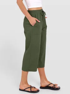 Side view of women's olive green cotton linen wide-leg pants with drawstring waist