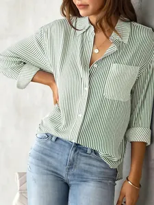 Close-up of casual women's loose long-sleeved shirt with green and white vertical stripes