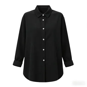 Detail view of a black long-sleeved cotton linen shirt with white buttons and lapel collar