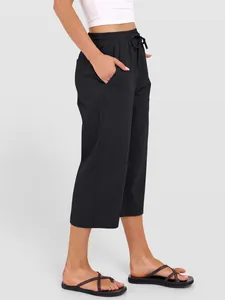 Side view of women's black cotton linen wide leg pants with drawstring
