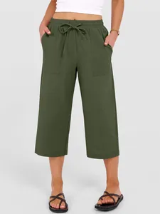 Close-up detail of women's olive green cotton linen wide-leg casual pants with drawstring