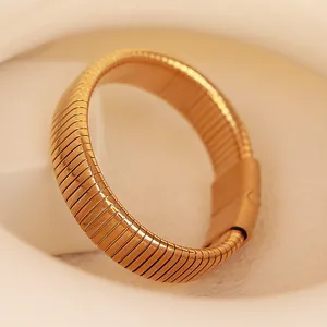 Elegant gold-tone elastic snake bracelet with a luxury metallic textured wrap design