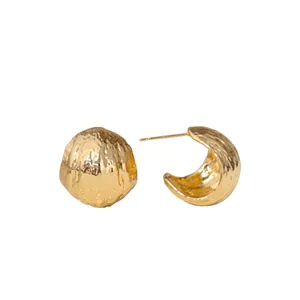 Detailed view of 18K gold plated textured geometric stud earrings with wrinkled surface