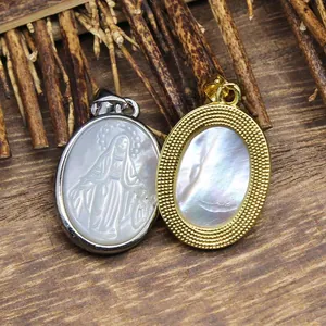 Natural mother of pearl oval pendants with Virgin Mary carving and gold frame detail.