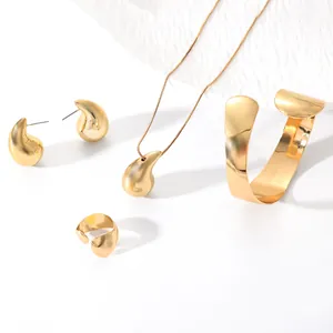 Complete gold-tone water drop jewelry set featuring earrings necklace bracelet and ring