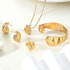 Elegant polished gold water drop jewelry set with necklace, earrings, cuff and ring