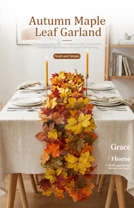 Detail view of lifelike artificial autumn maple leaf garland on a dining table.