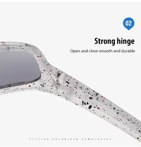 Close-up of durable metal hinge on polarized sunglasses with splatter pattern.