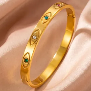 Detailed view of an 18K gold-plated titanium steel evil eye bangle with colorful zircons.