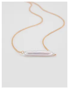 Detail view of a 925 sterling silver necklace with a long baroque pearl pendant.