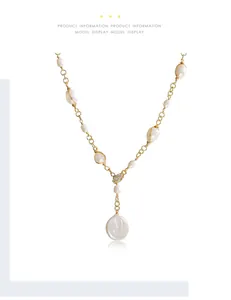 Baroque irregular pearl Y-necklace with gold chain and sparkling paved heart detail