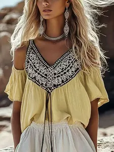 Bohemian yellow V-neck top with intricate embroidery and cold shoulder ruffle sleeves
