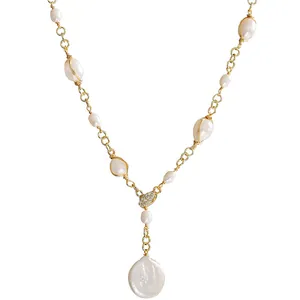 Elegant baroque pearl necklace featuring a gold chain and unique Y-shaped drop pendant