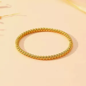 Elegant gold-plated stainless steel beaded bangle with engraved celestial star texture