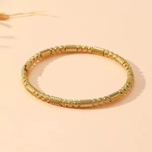 Luxury gold-plated stainless steel bangle with textured beads and cylindrical links