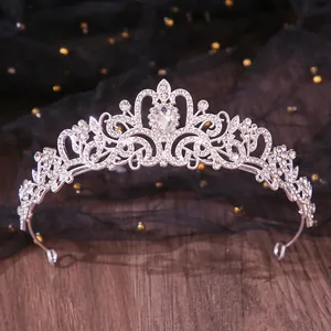 Detailed close-up of elegant bridal crystal tiara with shimmering rhinestones for weddings.