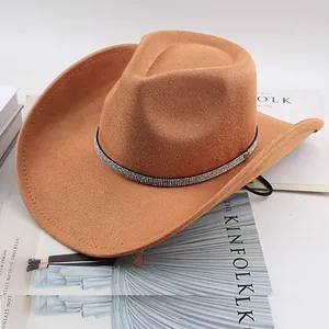 Close-up of camel western cowboy hat with sparkling rhinestone band on Kinfolk magazine