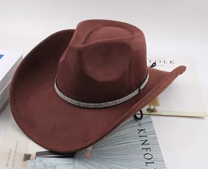 Detailed view of brown suede western cowboy hat with rhinestone band