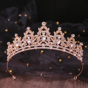 Close-up of sparkling rhinestone bridal tiara with intricate gold-toned metalwork
