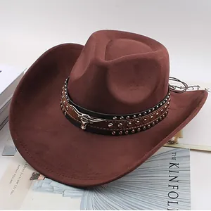 Detail of brown western cowboy hat with studded leather band and bull head ornament.