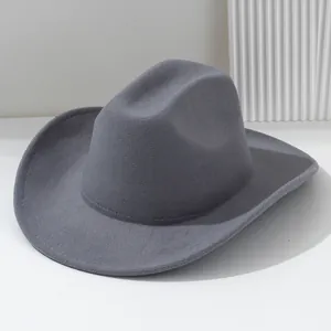 Detailed side view of a stylish grey soft felt cowboy hat with a structured brim