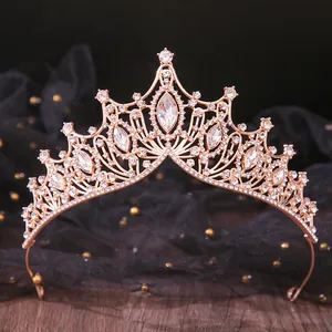 Elegant macro shot of rose gold bridal tiara featuring sparkling marquise rhinestones