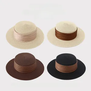 Detailed view of four colors of elegant French flat top straw sun hats with wide brims