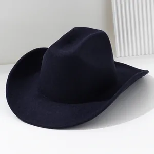 Close-up detail of a soft navy blue felt western cowboy hat featuring a minimalist design