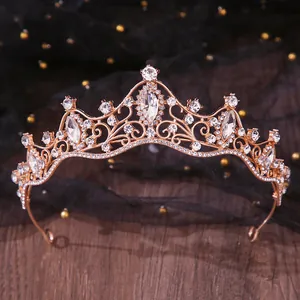 Detailed shot of an elegant rose gold bridal crown with shimmering clear rhinestones