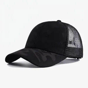 Detail view of black camouflage trucker hat with breathable mesh back for sun protection