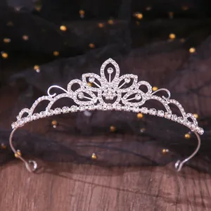 Elegant silver-toned bridal tiara crown featuring intricate rhinestone floral pattern details