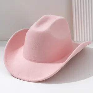Detailed macro view showing the texture of a stylish pink soft felt western cowboy hat