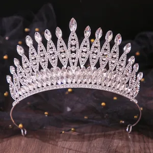 Detailed view of an elegant silver bridal tiara adorned with sparkling clear rhinestones.