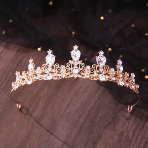 Elegant bridal tiara featuring sparkling teardrop rhinestones on rose gold filigree.