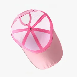 Detailed interior view of a pink mesh ponytail baseball cap showing the breathable structure