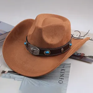Detail shot of brown western cowboy hat with bull head buckle and turquoise stones.